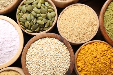 Photo of Different superfoods in bowls on table, flat lay