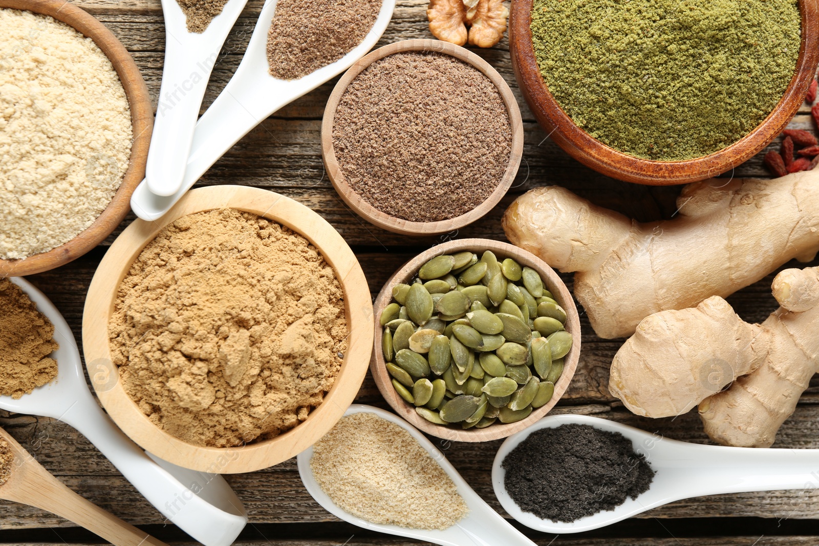 Different superfood products on wooden table, flat lay Photo of Different superfood products on wooden table, flat lay