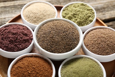 Photo of Different superfoods in bowls on table, closeup