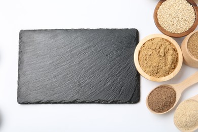 Photo of Different superfood powders in bowls, spoons and blank board on white background, flat lay. Space for text