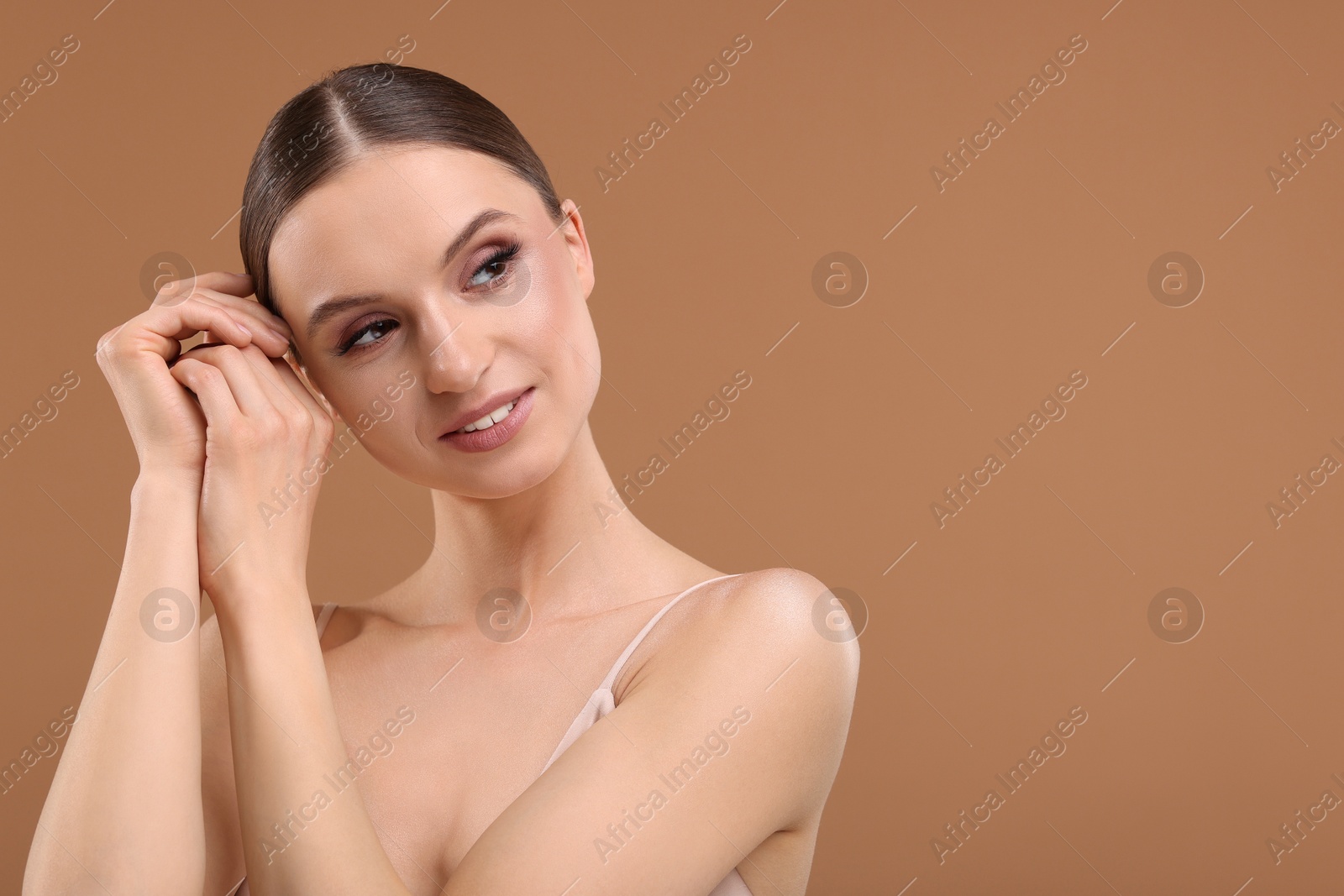 Portrait of beautiful young woman on beige background, space for text Photo of Portrait of beautiful young woman on beige background, space for text