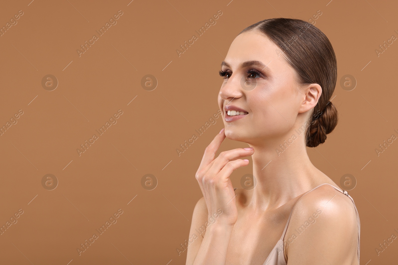 Portrait of beautiful young woman on beige background, space for text Photo of Portrait of beautiful young woman on beige background, space for text