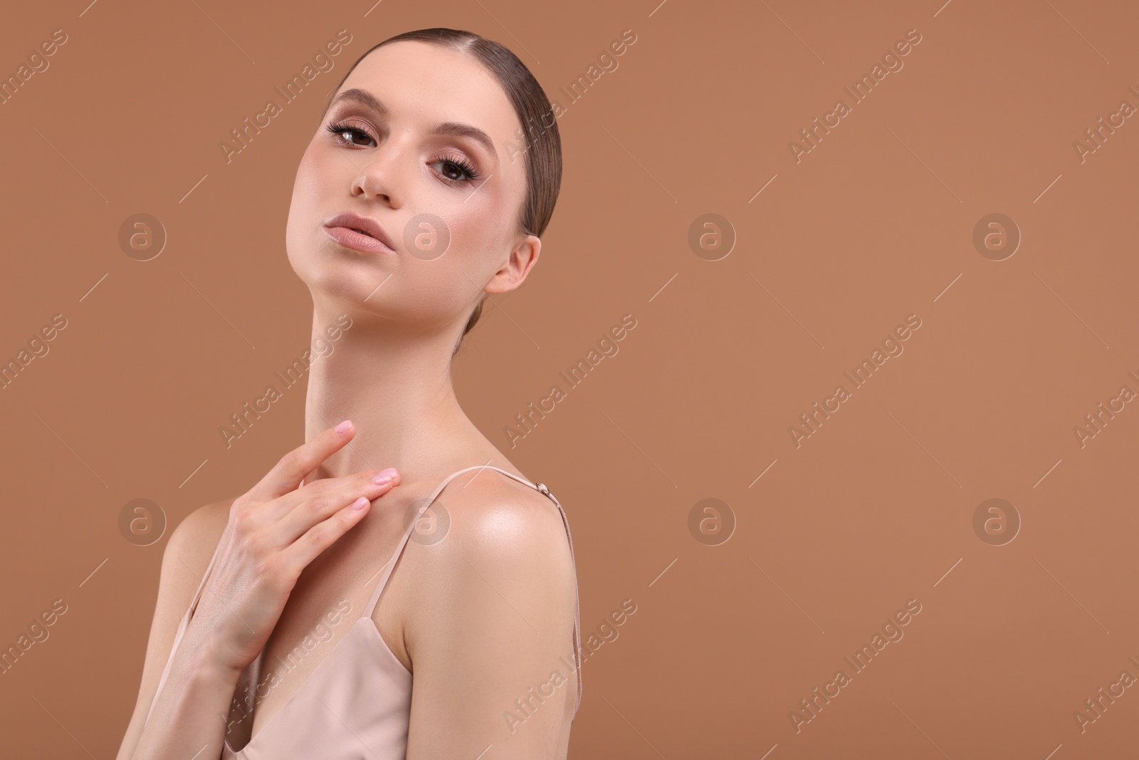 Portrait of beautiful young woman on beige background, space for text Photo of Portrait of beautiful young woman on beige background, space for text