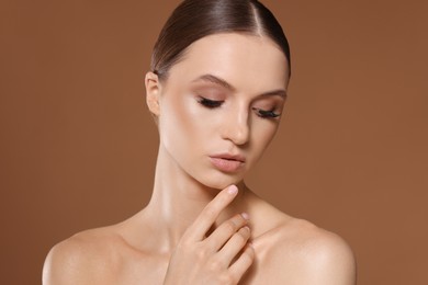 Photo of Portrait of beautiful young woman on beige background