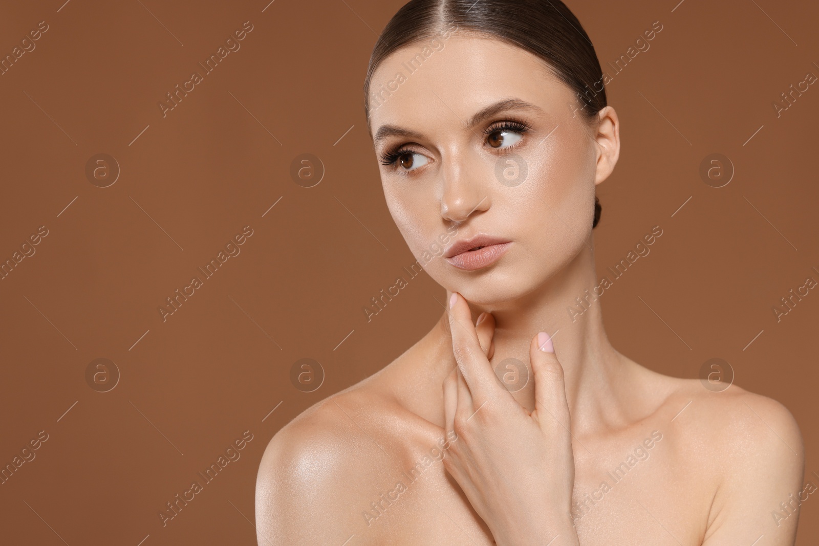Portrait of beautiful young woman on beige background, space for text Photo of Portrait of beautiful young woman on beige background, space for text
