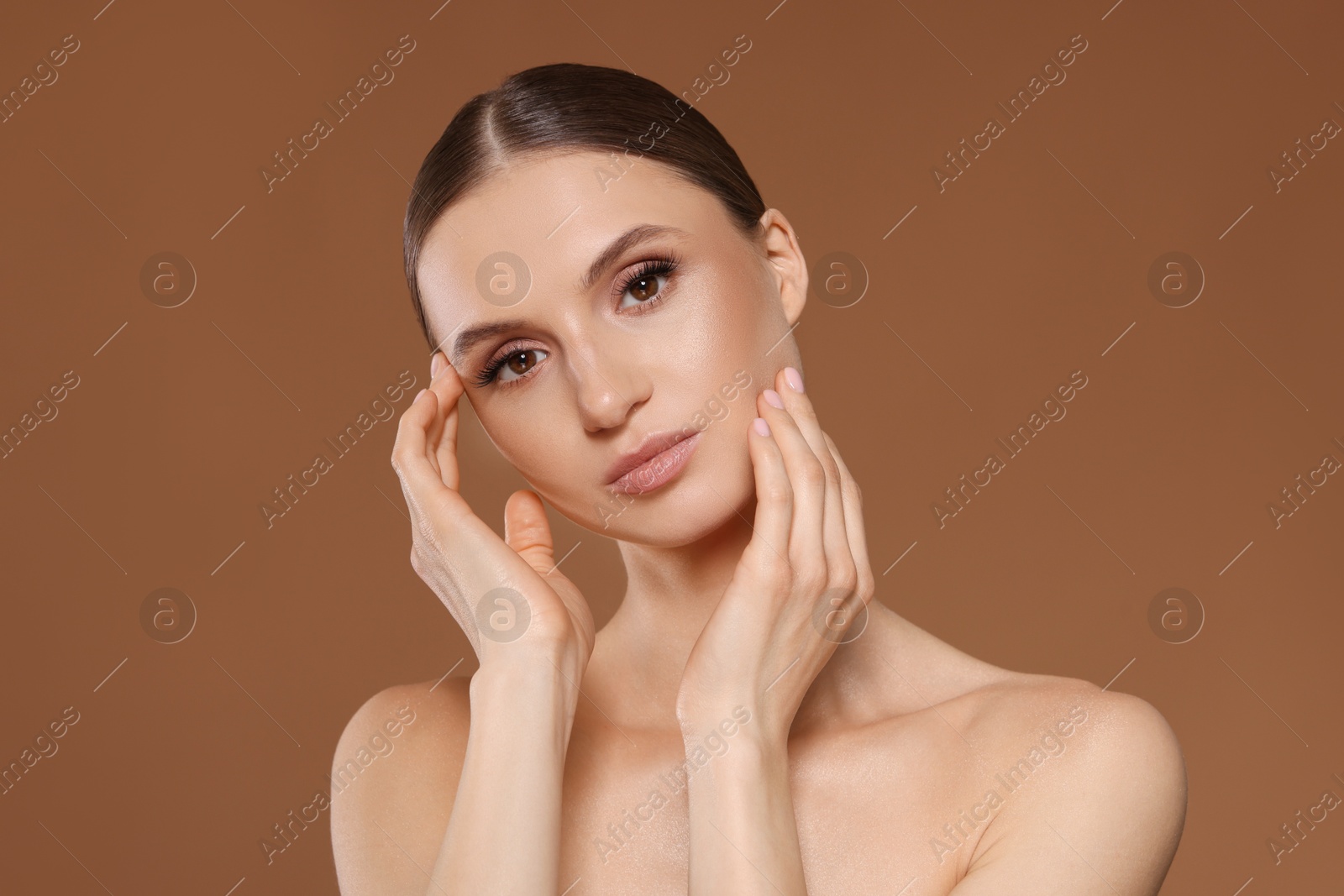 Portrait of beautiful young woman on beige background Photo of Portrait of beautiful young woman on beige background
