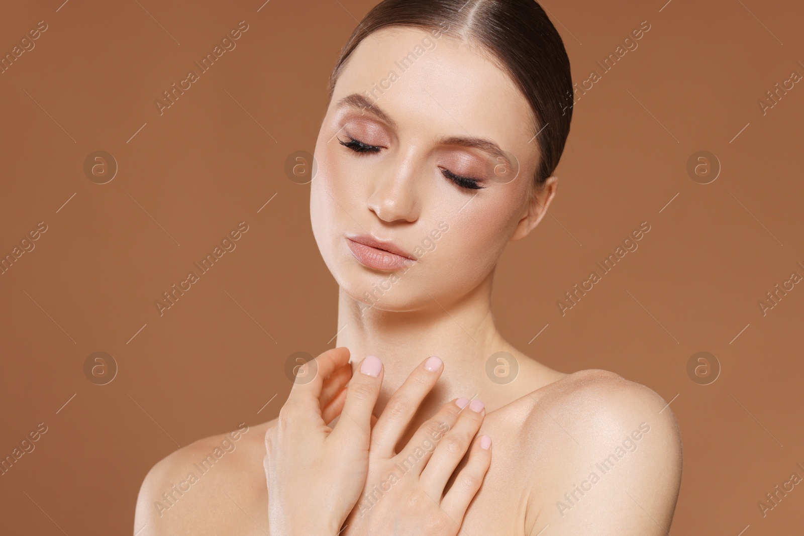 Portrait of beautiful young woman on beige background Photo of Portrait of beautiful young woman on beige background