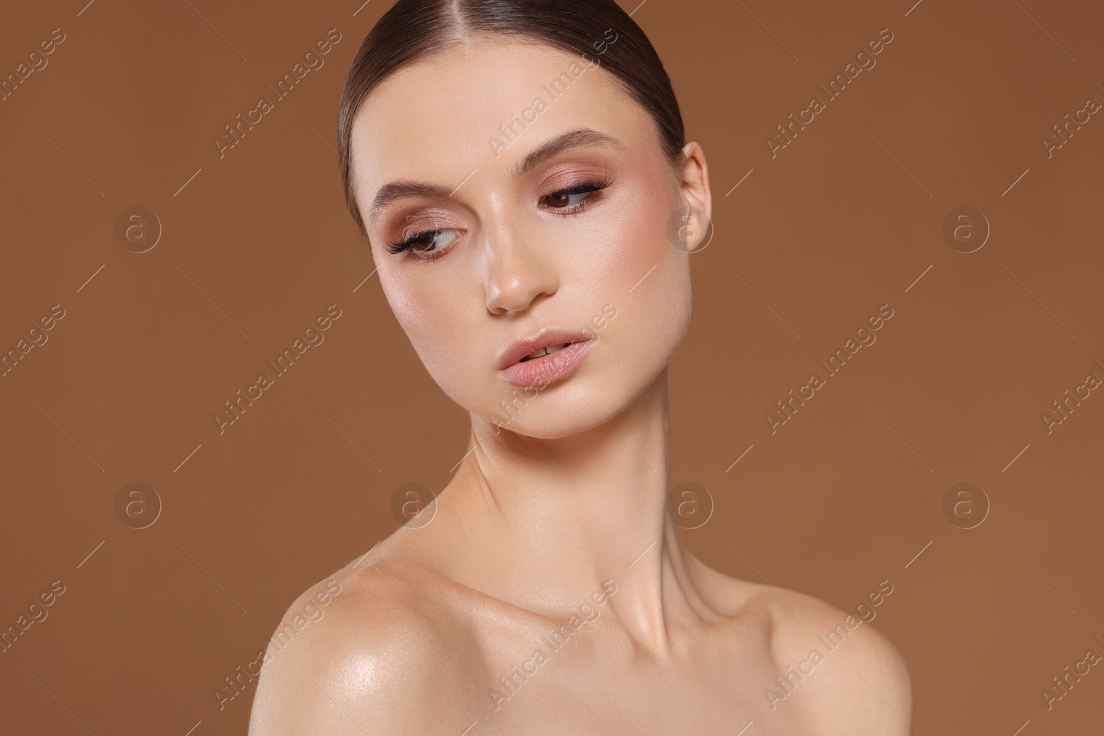 Portrait of beautiful young woman on beige background Photo of Portrait of beautiful young woman on beige background