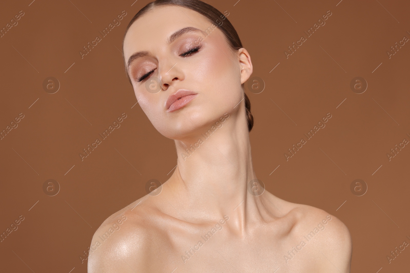 Portrait of beautiful young woman on beige background Photo of Portrait of beautiful young woman on beige background