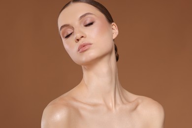 Photo of Portrait of beautiful young woman on beige background