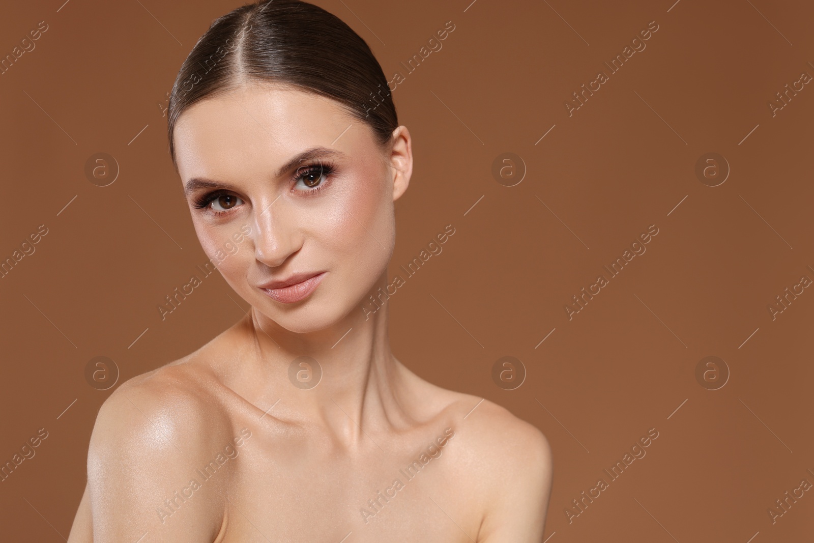 Portrait of beautiful young woman on beige background, space for text Photo of Portrait of beautiful young woman on beige background, space for text