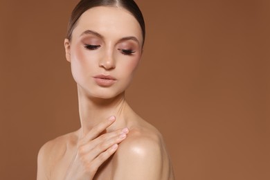Photo of Portrait of beautiful young woman on beige background, space for text