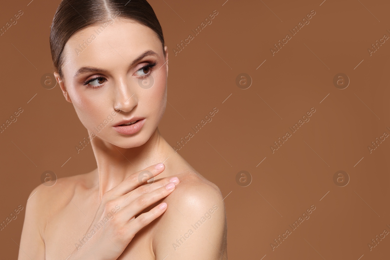 Portrait of beautiful young woman on beige background, space for text Photo of Portrait of beautiful young woman on beige background, space for text