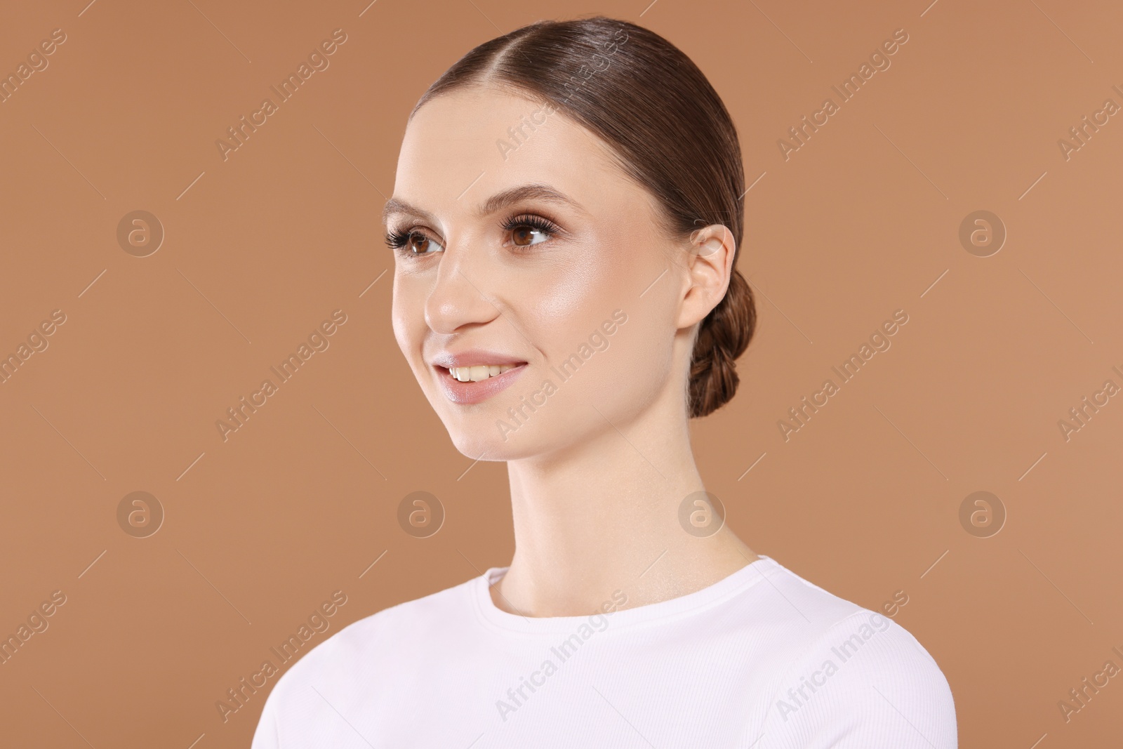 Portrait of beautiful young woman on beige background Photo of Portrait of beautiful young woman on beige background