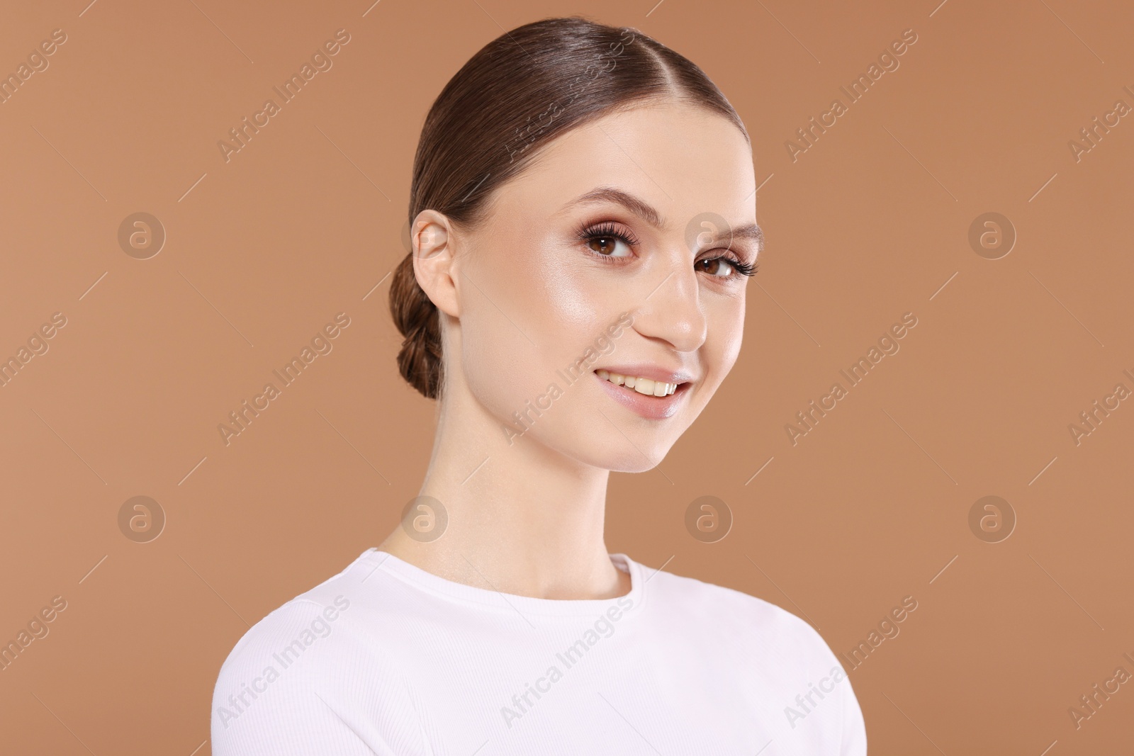 Portrait of beautiful young woman on beige background Photo of Portrait of beautiful young woman on beige background