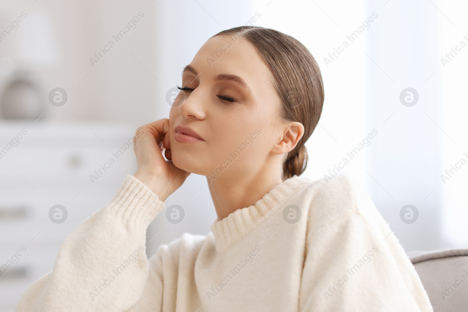 Portrait of beautiful young woman at home Photo of Portrait of beautiful young woman at home