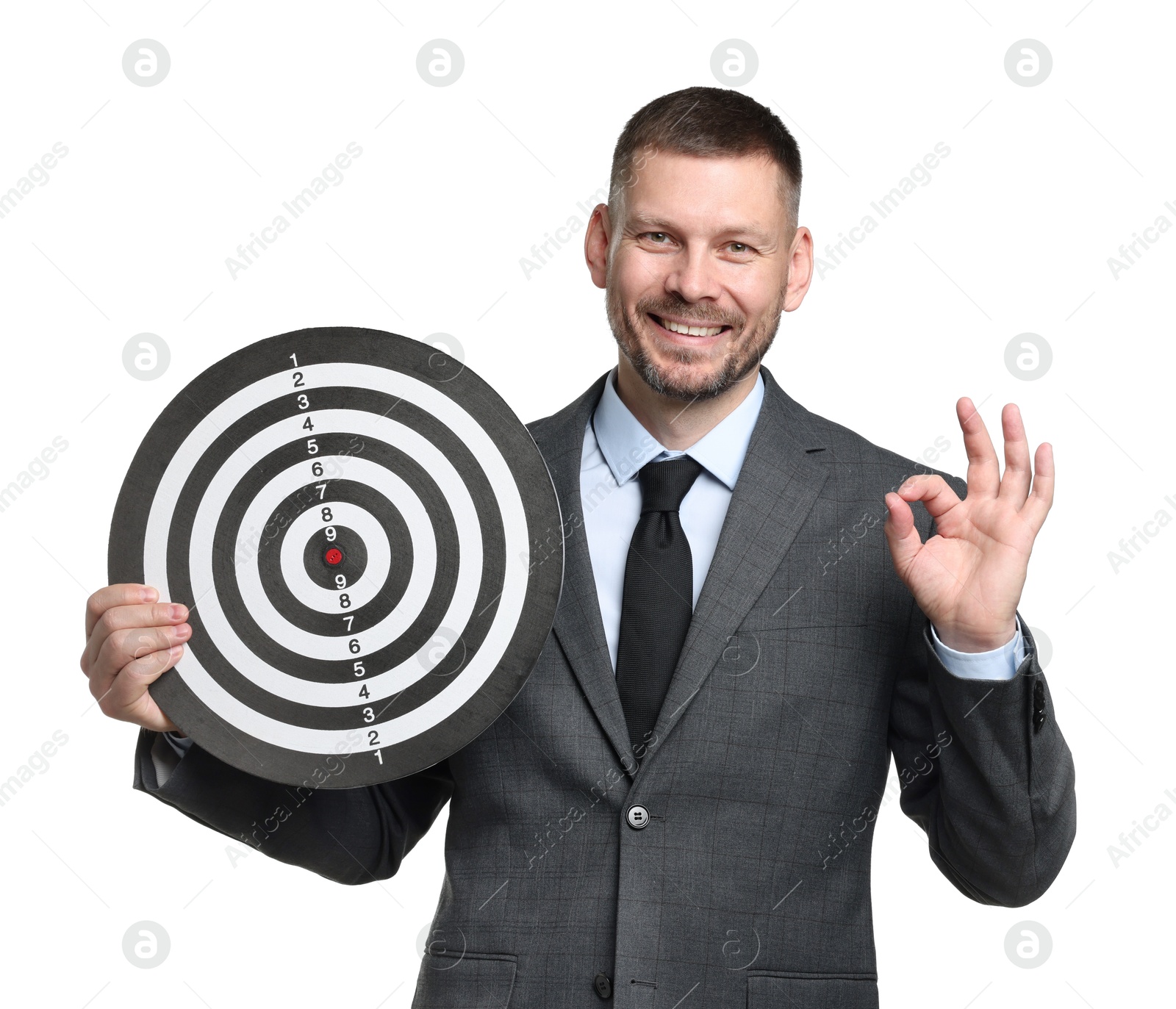Targeting. Man with dart board showing ok gesture on white background Photo of Targeting. Man with dart board showing ok gesture on white background