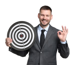 Photo of Targeting. Man with dart board showing ok gesture on white background