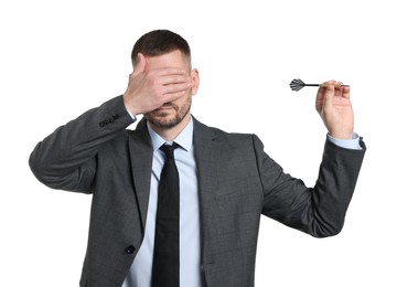 Photo of Targeting. Man with dart covering eyes on white background