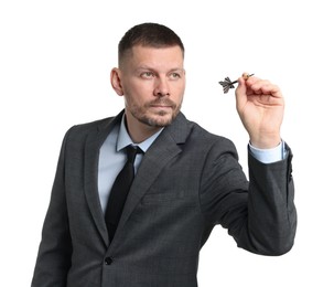 Photo of Targeting. Man with dart aiming on white background