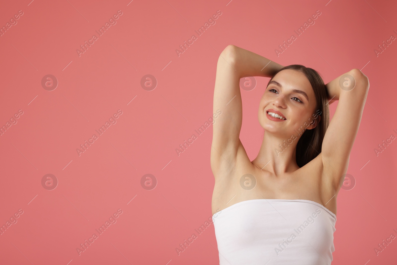 Portrait of beautiful young woman on pink background. Space for text Photo of Portrait of beautiful young woman on pink background. Space for text
