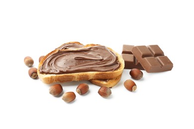 Photo of Toasts with tasty chocolate spread, pieces and hazelnuts isolated on white