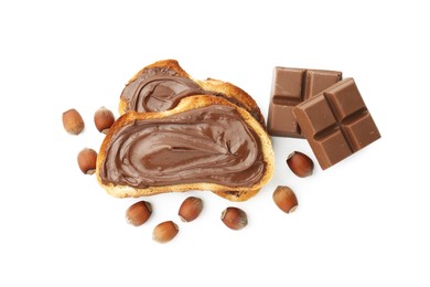 Photo of Toasts with tasty chocolate spread, pieces and hazelnuts isolated on white, top view