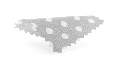 Photo of Sample of grey fabric with polka dot isolated on white