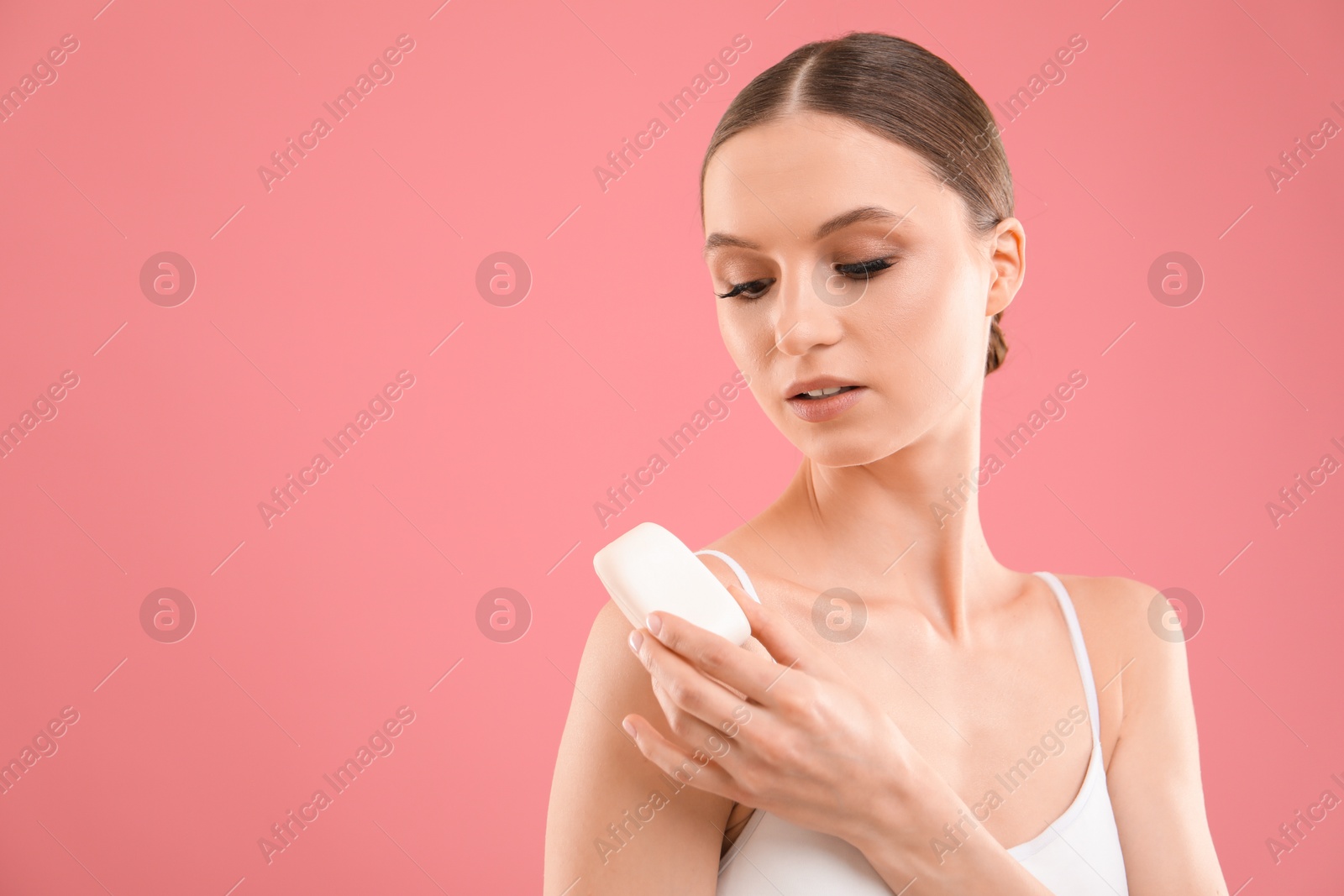 Beautiful woman with soap bar on pink background. Space for text Photo of Beautiful woman with soap bar on pink background. Space for text