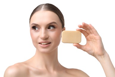 Photo of Smiling woman with soap bar on white background