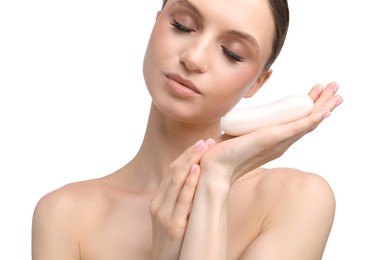 Photo of Beautiful woman with soap bar on white background
