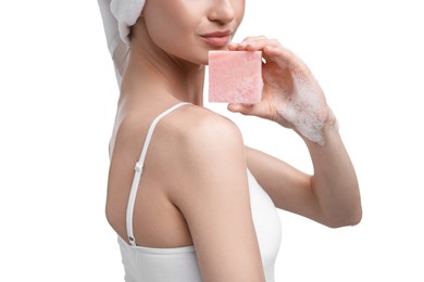 Photo of Woman with soap bar on white background, closeup