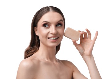 Photo of Smiling woman with soap bar on white background, closeup