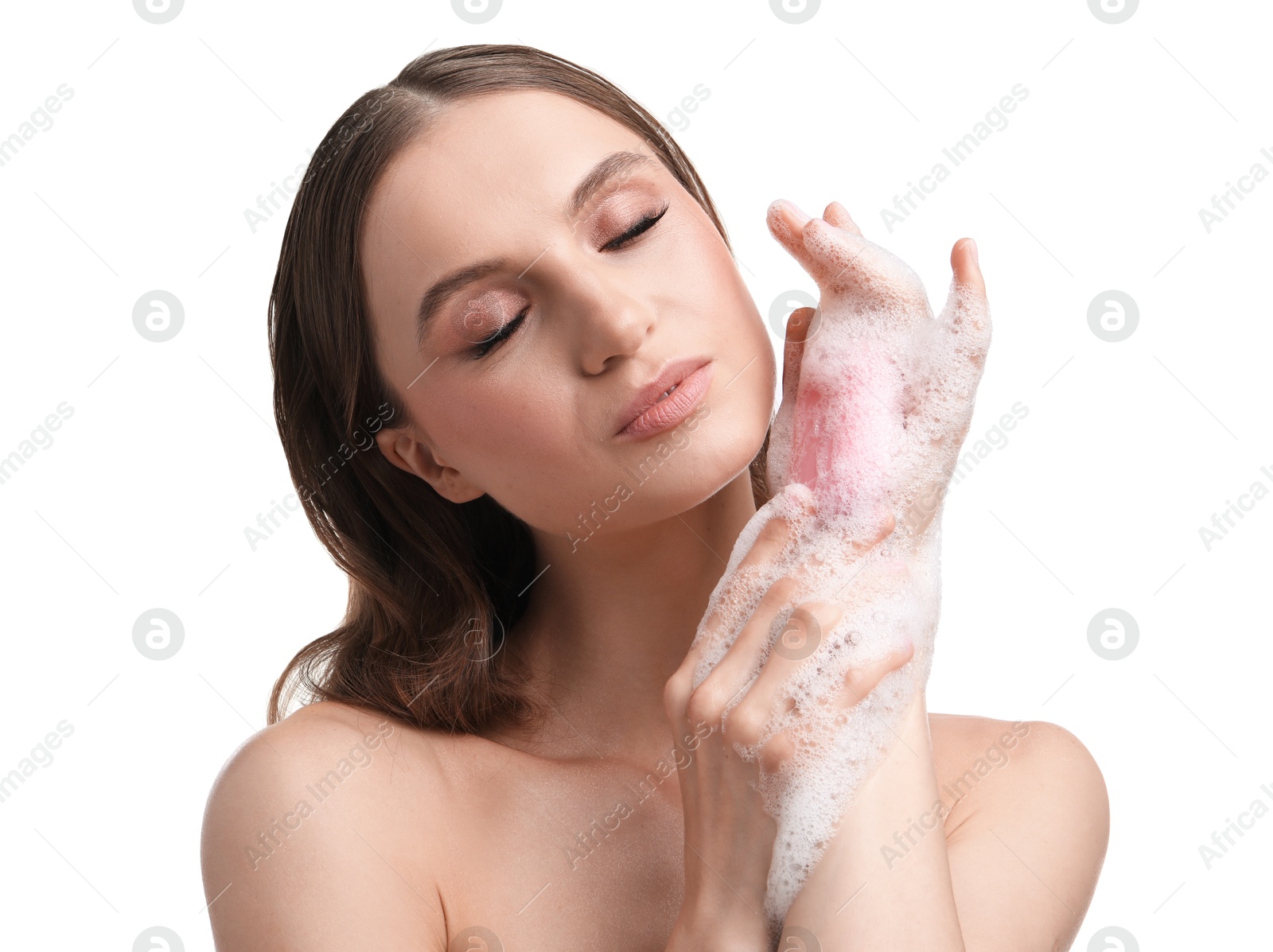 Beautiful woman washing hands with soap bar on white background, closeup Photo of Beautiful woman washing hands with soap bar on white background, closeup