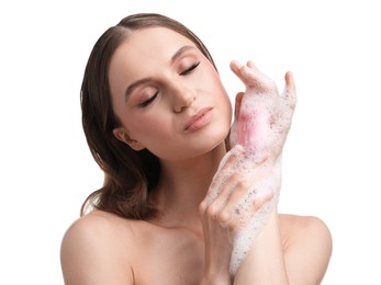 Photo of Beautiful woman washing hands with soap bar on white background, closeup