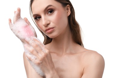 Photo of Beautiful woman washing hands with soap bar on white background, closeup