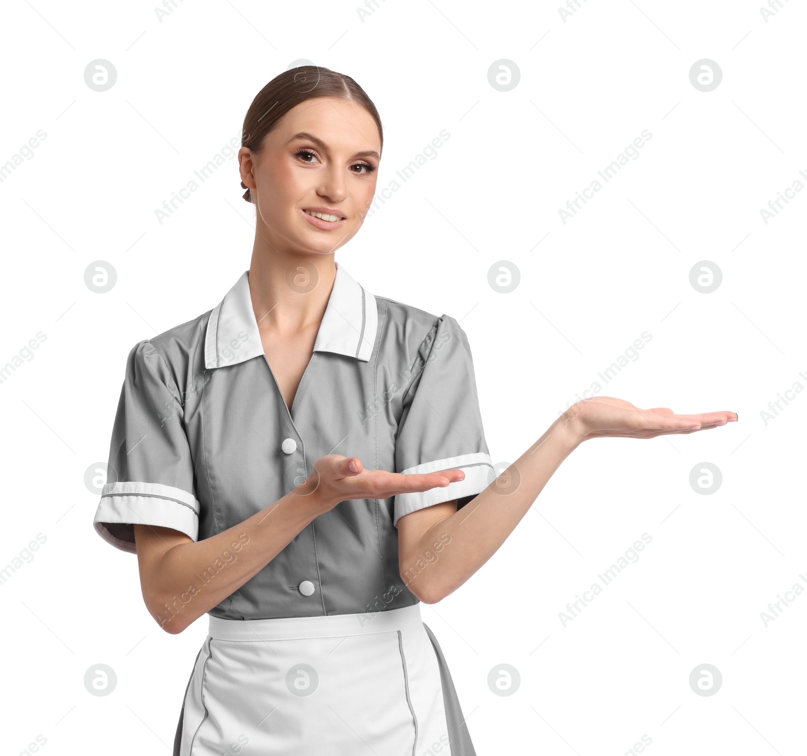 Portrait of smiling chambermaid on white background Photo of Portrait of smiling chambermaid on white background