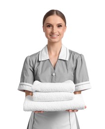 Photo of Chambermaid with stack of clean towels on white background