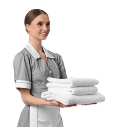 Photo of Chambermaid with stack of clean towels on white background