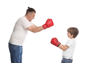 Photo of Father and his son in boxing gloves on white background