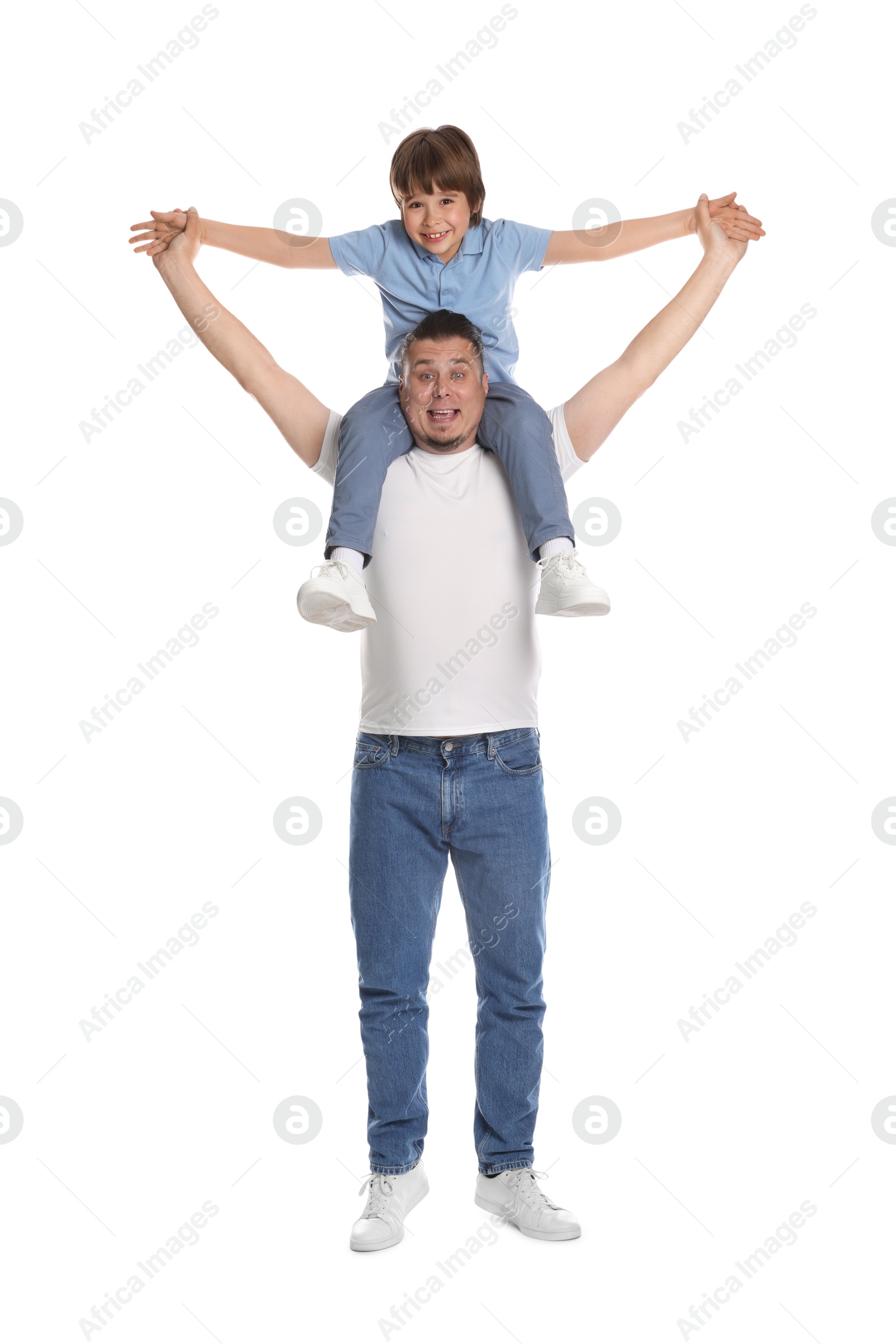 Father and his son having fun together on white background Photo of Father and his son having fun together on white background