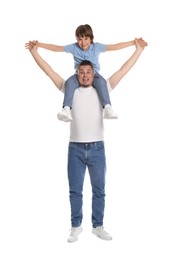 Photo of Father and his son having fun together on white background