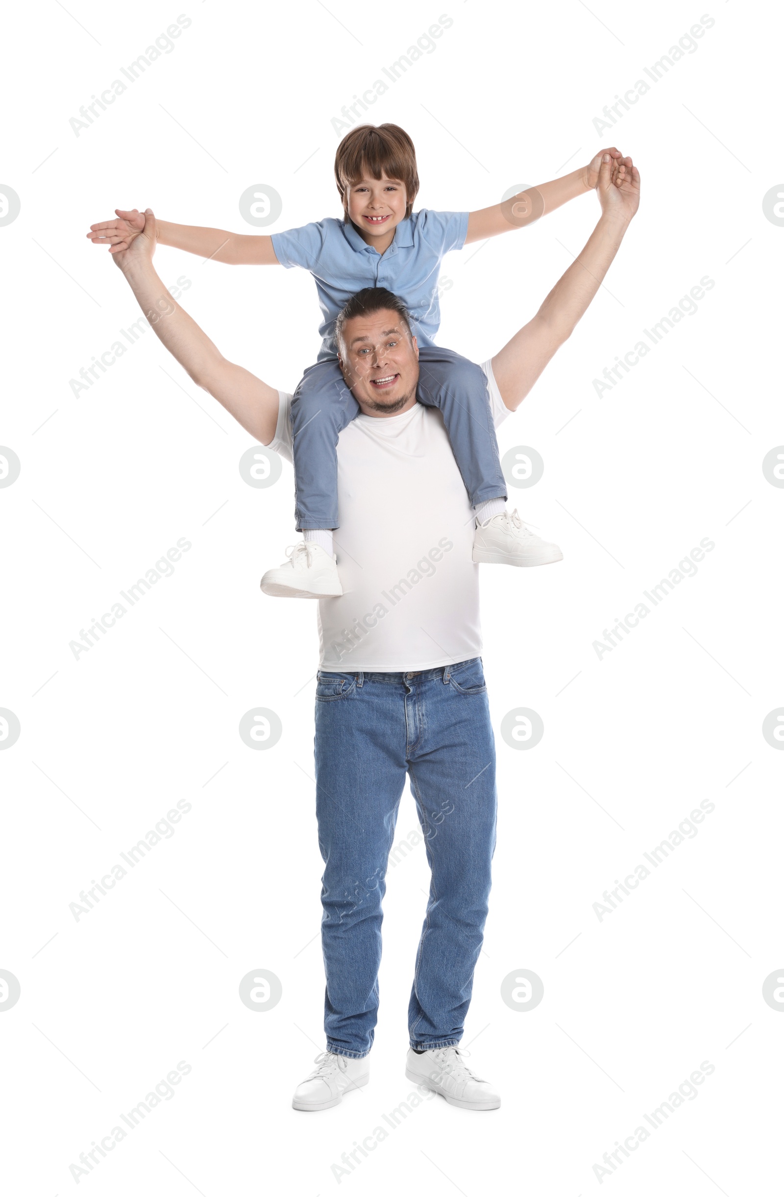 Father and his son having fun together on white background Photo of Father and his son having fun together on white background