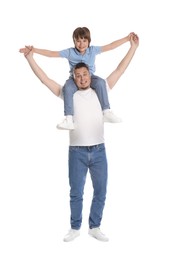 Photo of Father and his son having fun together on white background