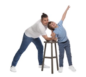 Photo of Father with his son arm wrestling on white background