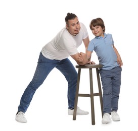 Photo of Father with his son arm wrestling on white background