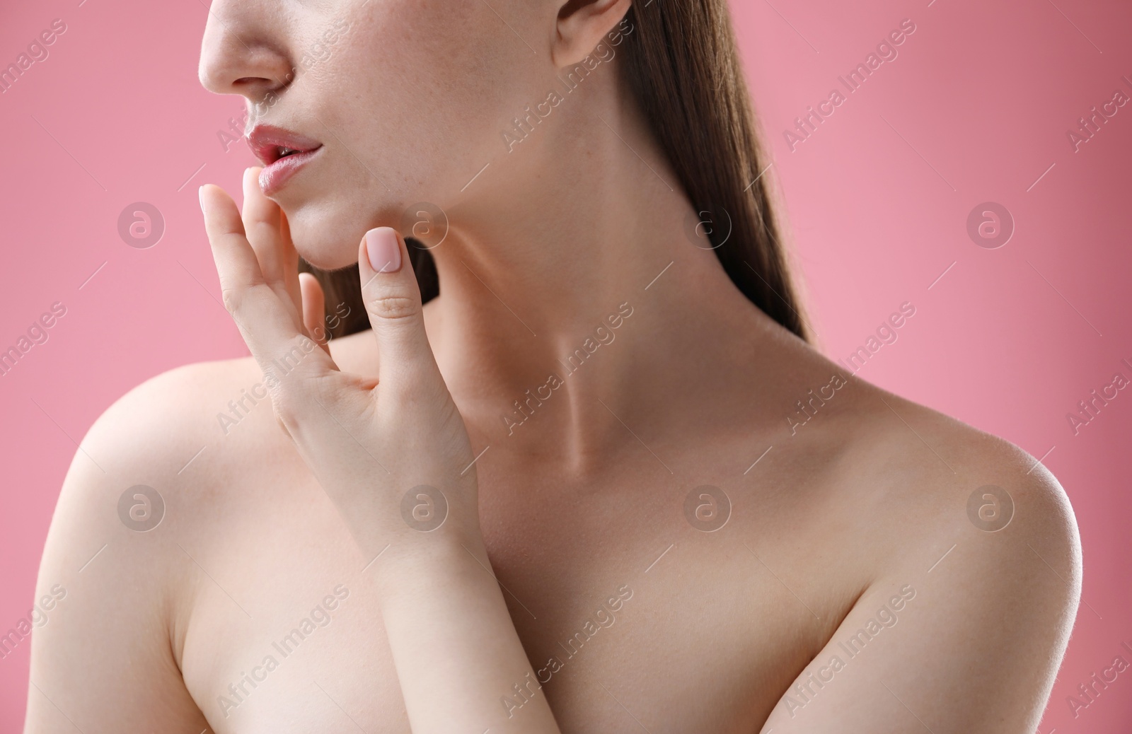 Woman with beautiful collarbones and neck on pink background, closeup Photo of Woman with beautiful collarbones and neck on pink background, closeup
