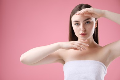Photo of Portrait of beautiful woman on pink background. Space for text