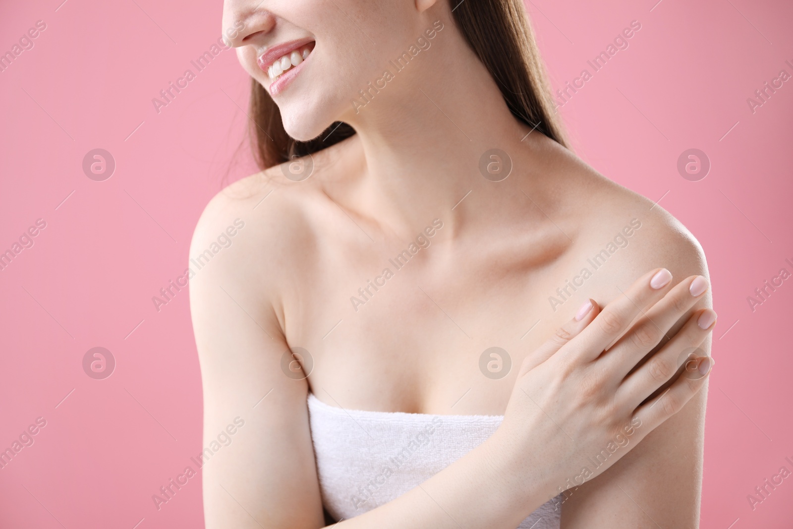 Woman with beautiful collarbones and neck on pink background, closeup Photo of Woman with beautiful collarbones and neck on pink background, closeup