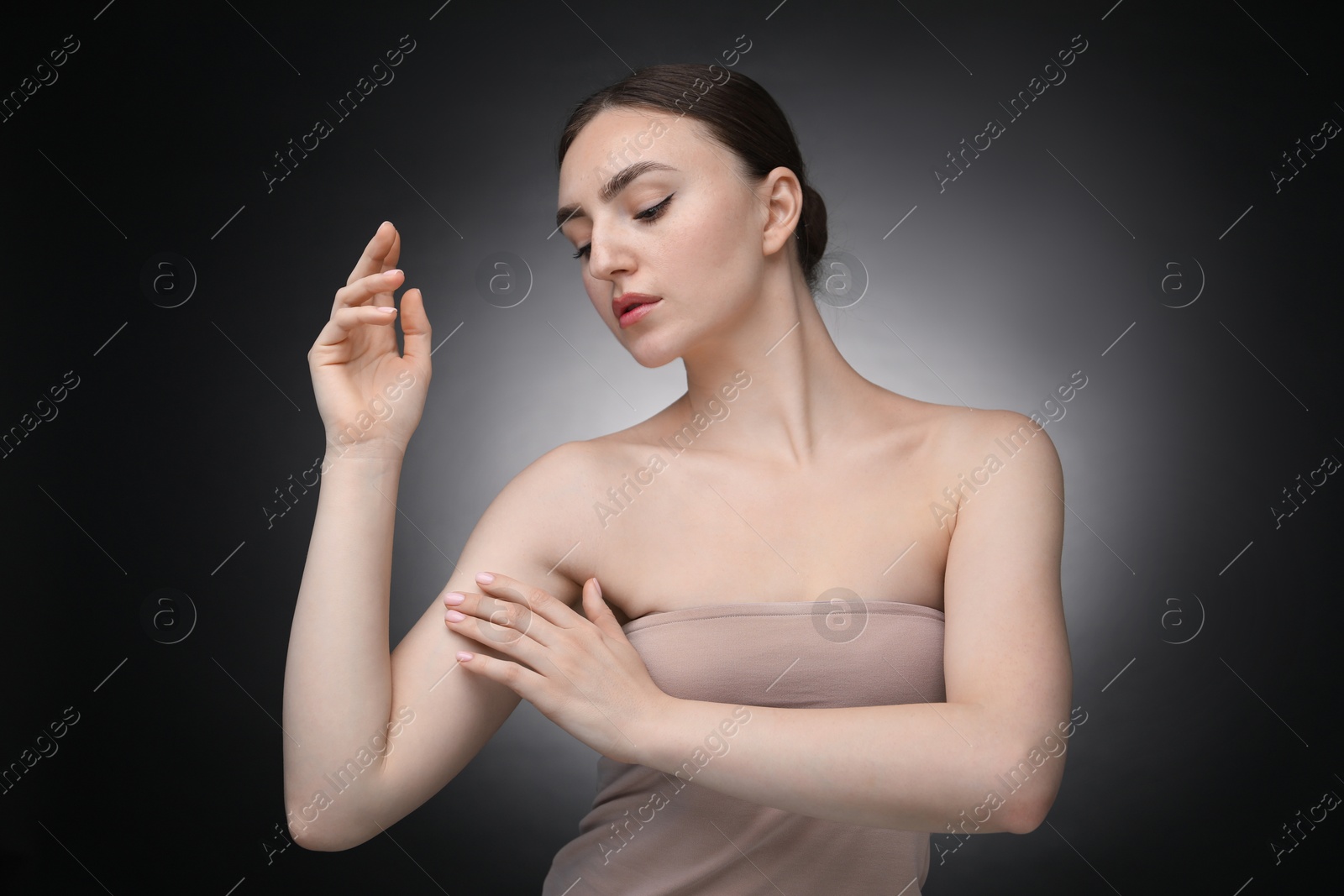 Portrait of beautiful woman on black background Photo of Portrait of beautiful woman on black background
